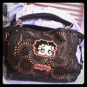 Black Betty Boop purse with gold accents.